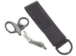 PRODUCT DESCRIPTION OMS Sea Snips with nylon sheath. The sheath mounts to any two inch webbing and has a Velcro® closure. Total length is {8.5 in | 21.9 cm} and width is {2.5 in | 6.3 cm} with a plastic D-ring at the base. Can be mounted vertically in either position with handle pointed up or down as you prefer. Shears are securely enclosed by the nylon flap top when not in use. OMS logo in yellow is screen printed at the bottom.